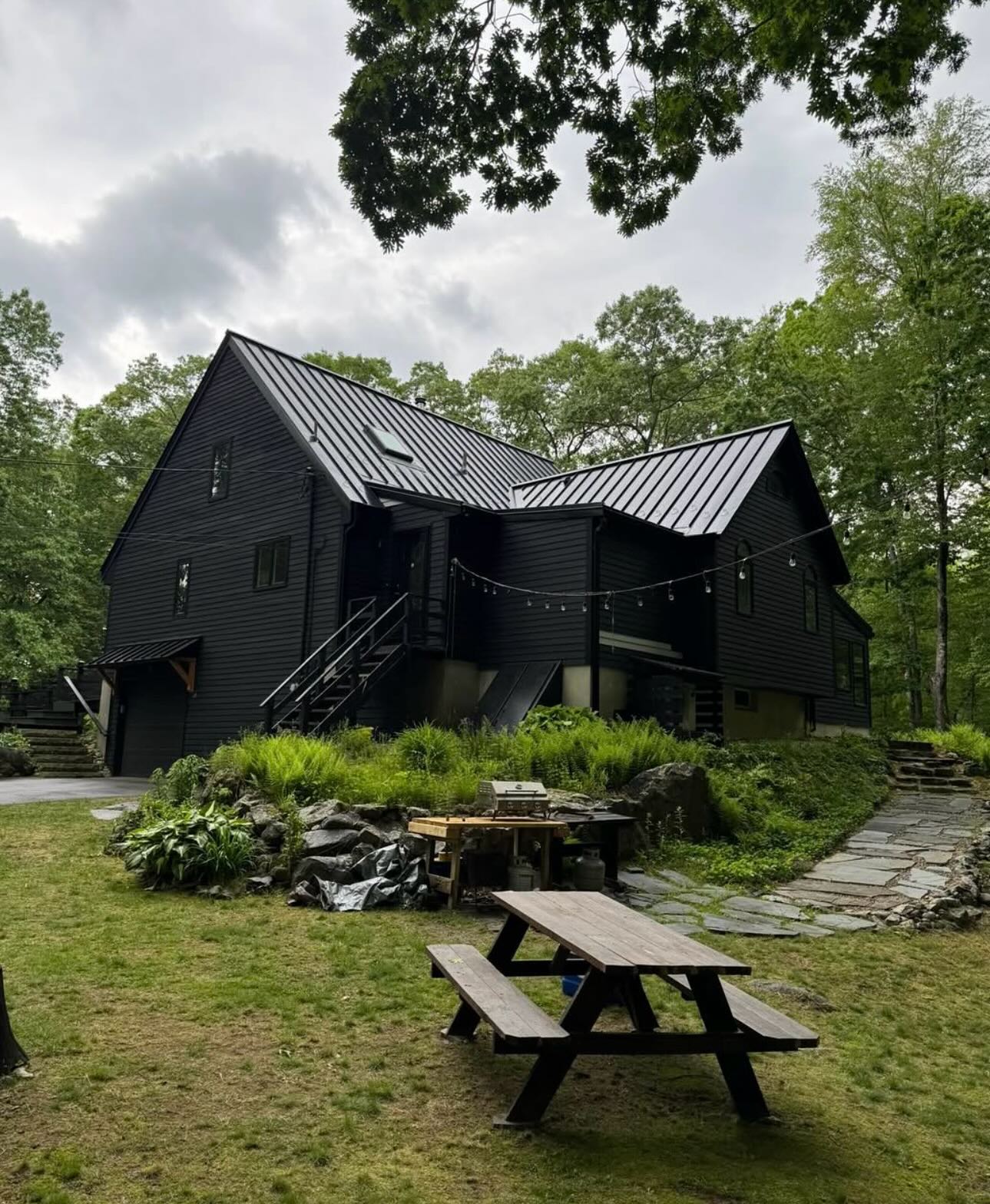 Black standing seam metal roof on a North Shore home