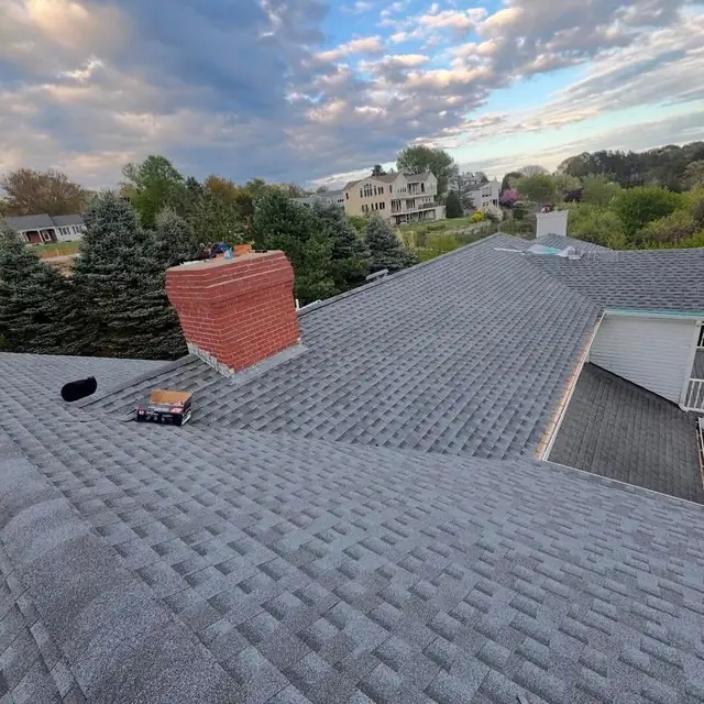 Newly installed asphalt shingle roof on a Massachusetts home