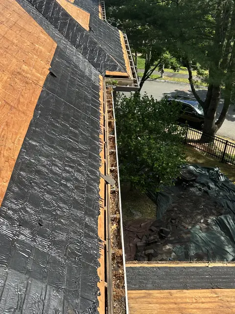 Roof stripped to the plywood deck with ice and water shield along the eaves